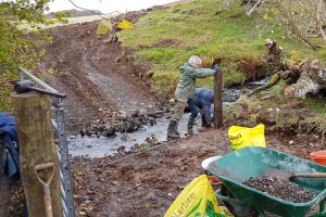 Roddy is due to bring the sheep back to the croft soon, but first he enlists Mike's help to install a new sheep-retaining gate and fence to stop them coming over onto the building site.