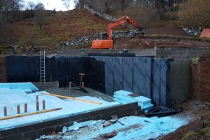 The earth-retaining wall is now fully tanked and the lower-floor area is being made ready for the concrete pour...