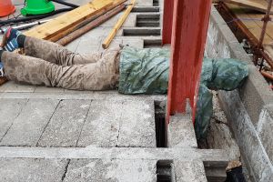 ...or Mike finds himself lying face down on a cold concrete floor, on a particularly wet and midgy day, stuffing insulation into the cavity below.
