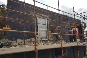 Frankie and Fela are working their way along the west wall; Mike discusses the next steps with them.