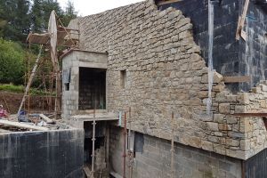 Round on the north side of the house, the stonework is almost complete...