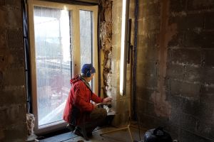 The bedroom windows are due to be boarded in soon, so Mike checks the insulation in the reveals, and vacuums out any accumulated dust, dirt and building rubble.