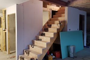 The (almost finished) toilet wall is also the wall of the stairs to the mezzanine.