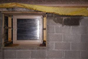 Water ingress has become a nagging problem as the weather turns stormy in December. We're still waiting for the zinc cappings to go on the roof, so water is still getting into the cavities in places. This is a window at the east end of the mezzanine.