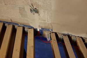 These cables for the sockets on the mezzanine have been run under the floor through holes drilled in the i-beams. This can be time-consuming and difficult as the mezzanine floor joists are very close together, so getting between them to drill the holes is a challenge.
