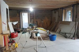 The kitchen - currently piled high with old and new plasterboard and other offcuts.