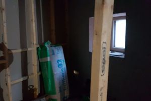 Guest bathroom: one stud partition wall still to be built. Currently a junk room....
