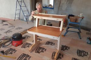 Taking a break from wiring jobs, Mike turns the empty mezzanine into a temporary carpentry workshop and builds himself a mixing desk for his future studio. An exercise in recycling, he's built it from used shuttering-ply and other bits of timber found lying around on site.